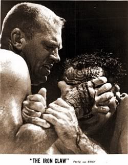 One of Texas wrestling's most iconic images: Cowboy Bob Ellis feels the agonizing effects of Fritz Von Erich's patented Iron Claw